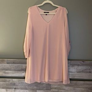 Dress with cutouts down arms.